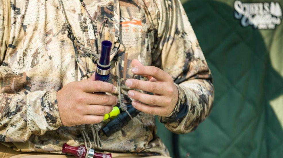 hunter holding duck calls